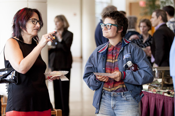 Rand connects with former student Grace Glasson '14 at the reception in Perry Atrium. (Sarah Crosby/Bates College)