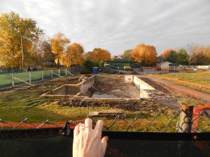 Seen over the construction fence: A cellar hole on the site of the future 55 Campus Ave. student residence. (Doug Hubley/Bates College)