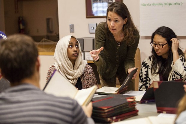 Education professor Mara Tieken and students visit the Edmund S. Muskie Archives to examine Lewiston school district archives, including census logs, superintendent reports and student portfolios, part of the course “Perspectives on Education.” (Sarah Crosby/Bates College)