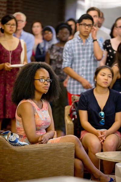 Nolwazi Ngwenyama '16 of Mbabane, Swaziland, listens to a speaker at the reception for the opening of the Office of Intercultural Education's new home in Chase Hall. She's an OIE Fellow for 2014-15. (Phyllis Graber Jensen/Bates College)