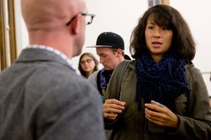 A student talks with Josh McIntosh, vice president for student affairs and dean of students, at an open forum on student life held in Memorial Commons on Oct. 21. (Phyllis Graber Jensen/Bates College)