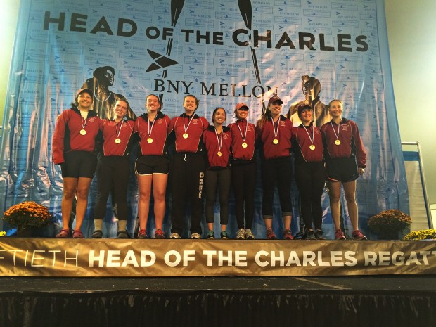 The women's varsity eight basks in the glow of victory following its win in the Women's Collegiate Eights at the Head of the Charles Regatta on Oct. 19, 2014. (Photograph by Andriel Doolittle)