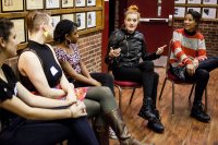 From right, Aino Jawo and Caroline Hjelt -- the Swedish DJ duo Icona Pop -- speak with Bates student leaders prior to their Campus Consciousness Tour concert on Nov. 1. Shown from left are Shana Wallace 'XX, Taylor B;lackburn 'XX and XXX. (Sarah Crosby/Bates College) 