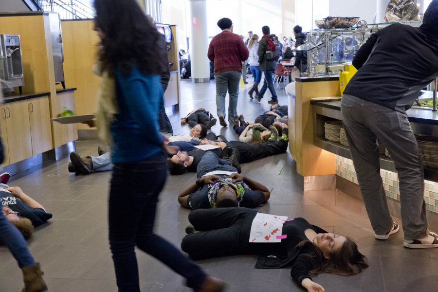 At lunchtime in Commons on Dec. 2, 50-plus students mounted a Ferguson-inspired protest art demonstration "to interrupt the flow of normal life so that we are prompted to truly question the society we live in," said organizer Annakay Wright ’17 of Brooklyn, N.Y. (Phyllis Graber Jensen/Bates College)