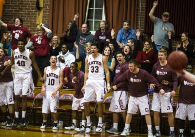 Players and fans in Alumni Gym erupt after a dunk by Graham Safford '15 of Stratton, Maine. Bates beat Bowdoin 71-51 on Dec. 4. (Sarah Crosby/Bates College)