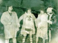  From left, Mark Stevens '77, Scott Copeland '78, Chris Callahan '78, Lars Llorente '78, the founders of the Puddle Jump, prepare for the inaugural dip in 1975. Over the years, students slowly "migrated" the event away from March, when it was known as the the St. Patrick's Day Dip, to Winter Carnival week. 