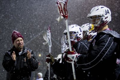 Men's lacrosse coach Peter Lasagna speaks to the team during a game last March. This year's season starts Feb. 28. (Sarah Crosby/Bates College)