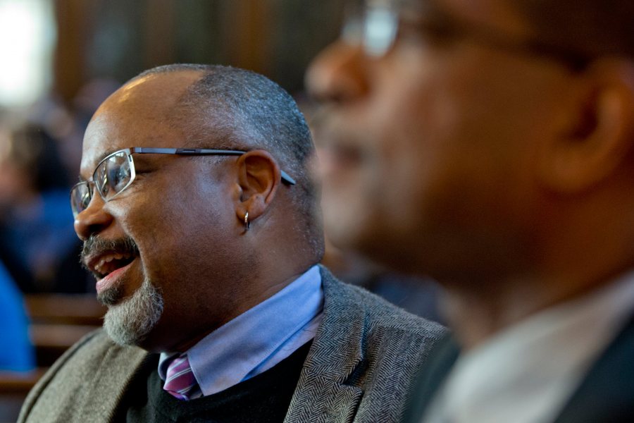 Marcus Bruce '77, Benjamin E. Mays Distinguished Professor of Religious Studies, and Associate Dean of Students James Reese (foreground) listen to the 2015 MLK Day keynote address. (Phyllis Graber Jensen/Bates College)