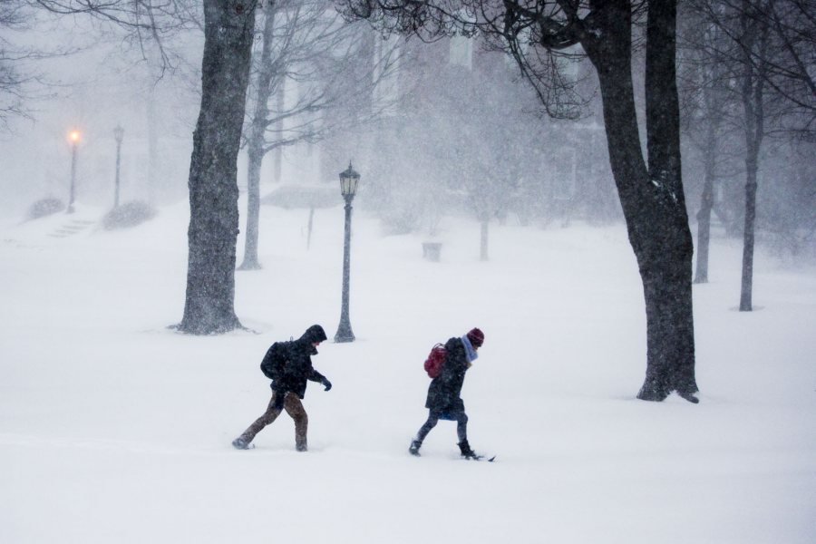 As a blizzard rages, students cross the Historic Quad during the morning hours of Jan. 27, 2015. (Phyllis Graber Jensen/Bates College)