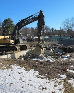 Removing the remnants of a Bardwell Street house foundation on Jan. 20, 2015. (Doug Hubley/Bates College)