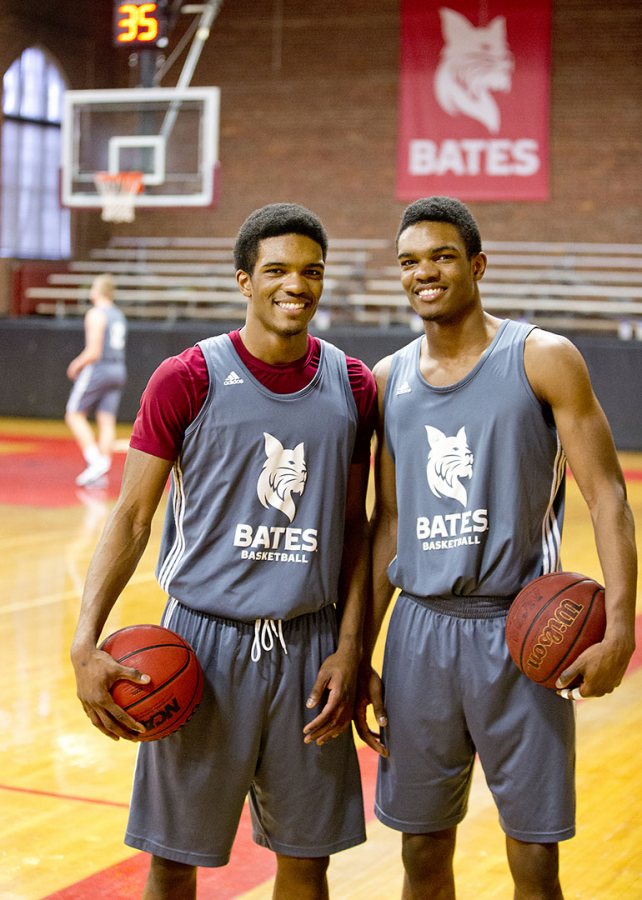 Marcus Delpeche '17 (left) and Malcolm Delpeche '17, identical twin brothers from Wilmington, Del., pose for a photograph during practice in Alumni Gymnasium. (Phyllis Graber Jensen/Bates College)