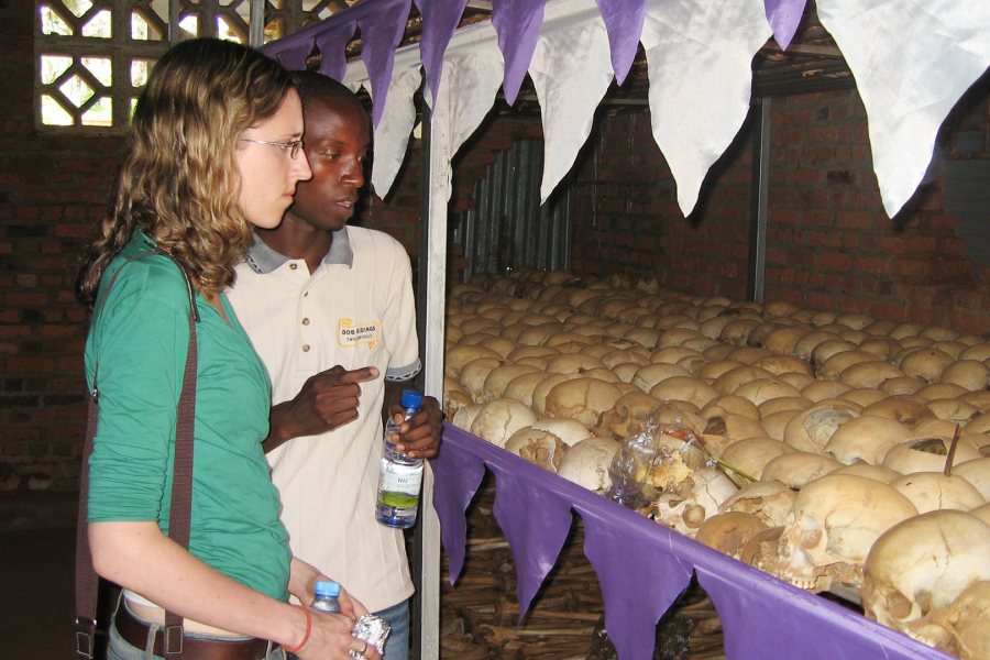 Together, Sarah Bravmann '12 and Alexis Mutimukunda face a genocide exhibit of human skulls at the Ntarama Memorial in Rwanda during the "Learning with Orphans of the Genocide in Rwanda" Short Term in 2009 led by Alex Dauge-Roth, associate professor of French and francophone studies. 