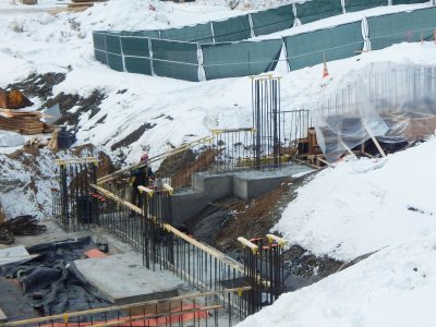 Foundation work extends down into the basement pit at 65 Campus Ave. on March 2, 2015. The vertical rebar forms will be piers to support columns. (Doug Hubley/Bates College)