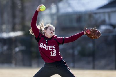 Kelsey Freedman '15 of Falmouth, Maine, delivers a pitch against Brandeis University in April 2015. (Josh Kuckens/Bates College) 