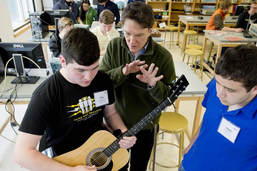 During an on-campus Admitted Student Reception, Professor of Physics (and guitarist) John Smedley works with two prospective Class of 2019 students in the “Musical Waves and Spectra” master class. (Phyllis Graber Jensen/Bates College)