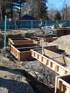 Wooden forms for wall (narrow) and spread (wide) footings at 55 Campus Ave. on April 14, 2015. (Doug Hubley/Bates College)