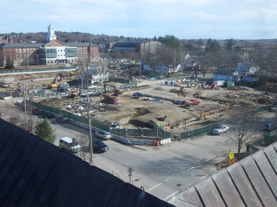 Somewhat distorted by reflections in the glass, this image of the Campus Avenue construction sites (65 Campus is to the left) was taken on April 14, 2015, from the Bates greenhouse atop Carnegie Science Hall. (Doug Hubley/Bates College)