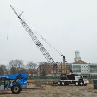 The Link-Bilt crane in place at the 65 Campus Ave. construction site on April 21, 2015, ready to start hoisting into place the steel framework of a new student residence. (Doug Hubley/Bates College)