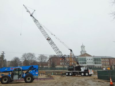 The Link-Bilt crane in place at the 65 Campus Ave. construction site on April 21, 2015, ready to start hoisting into place the steel framework of a new student residence. (Doug Hubley/Bates College)