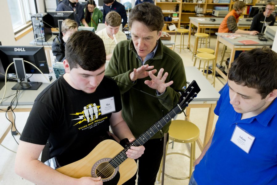 Professor of Physics (and guitarist) John Smedley works with two Class of 2019 admitted students in the "Musical Waves and Spectra" master class, offered during the on-campus Admitted Students Reception on April 10, 2015. (Phyllis Graber Jensen) 