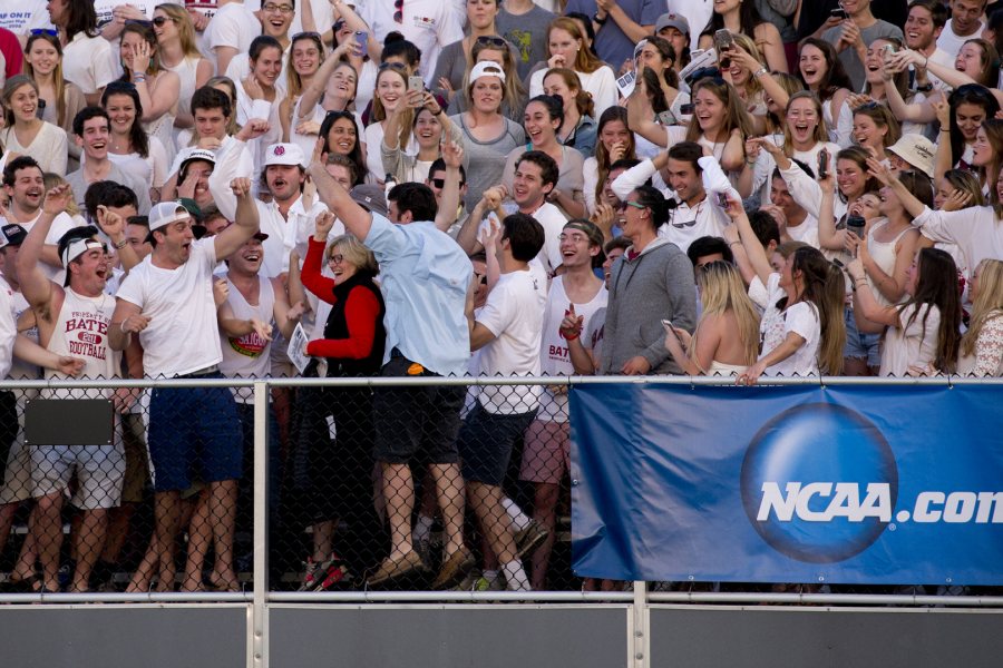 President Clayton Spencer gets caught up in the student euphoria as she arrives to join the excitement at Garcelon Field, where the men’s lacrosse team defeated Keene State in NCAA tournament play. (Phyllis Graber Jensen/Bates College)