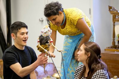 Sulochana Dissanayake '09 explains a fine point of puppet communications to students in the course Performing Musical Art of Indonesia, Taizaburo Inoue '18 of Toon-Shi, Japan, and Leah Zulkoski '15 of Charlotte, Vt. (Phyllis Graber Jensen/Bates College)