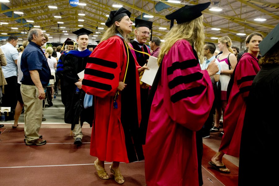 During the Commencement 2015 recessional, faculty members get into the spirit of music from the Atlantic Clarion Steel Band. (Phyllis Graber Jensen/Bates College)