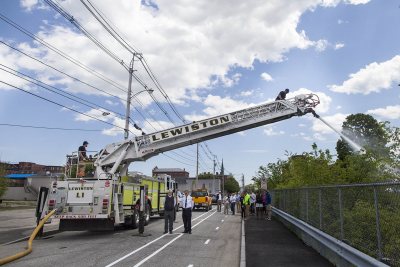 The demonstration bike lane complete, a truck from the Lewiston Fire Department arrives on May 21 to test the space for fire response. (Josh Kucken/Bates College)