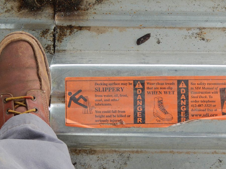 A safety warning on the steel floor decking at 65 Campus Ave. (Doug Hubley/Bates College)