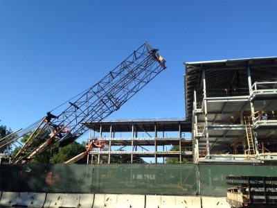 Folded crane: Its derrick collapsed for the road, the Link-Belt awaits departure from the 55 Campus Ave. site on July 31, 2015. (Doug Hubley/Bates College)