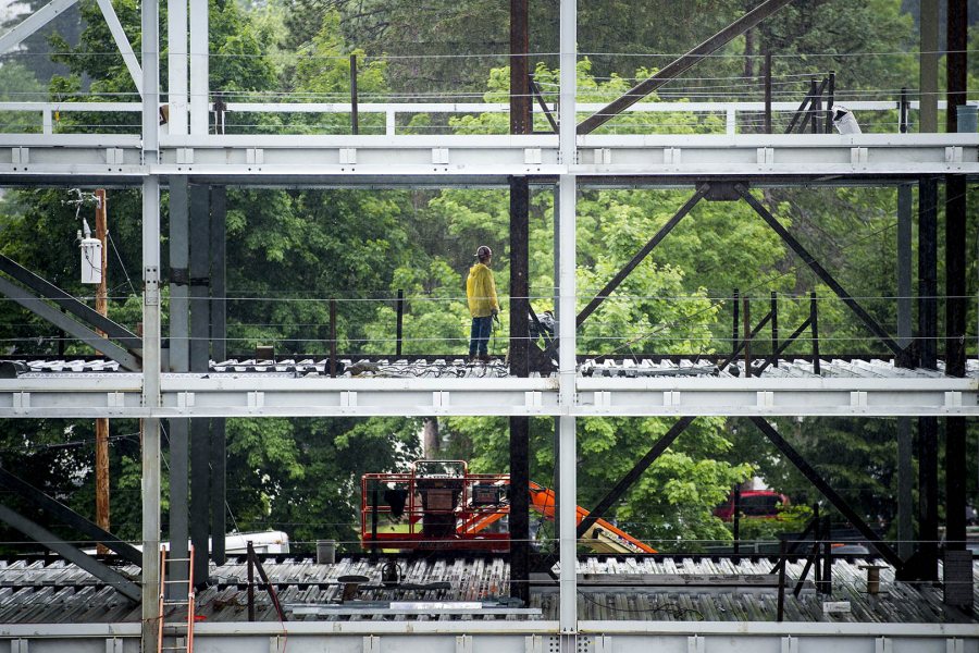 Work continues through the rain at 55 Campus Avenue on July 1, 2015. (Josh Kuckens/Bates College)