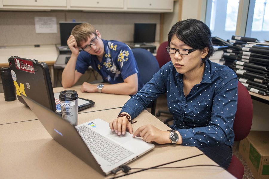 Fan Dong, '17, at right, is serving as a research assistant to economics professor Nathan Tefft this summer, helping to assess potential health benefits of fracking. With her is a second Tefft research assistant, Mike Varner '17, who is studying economic determinants of household expenditures on dietary supplements. (Josh Kuckens/Bates College)