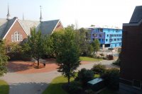 The Chase Hall courtyard with the 55 Campus Ave. student residence in the background, photographed on Sept. 2, 2015. (Doug Hubley/Bates College)