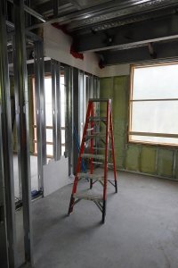 Watch this space: Serving as a mockup, this third-floor single bedroom at 65 Campus Ave. will be finished early in order to pre-test construction techniques. (Doug Hubley/Bates College)