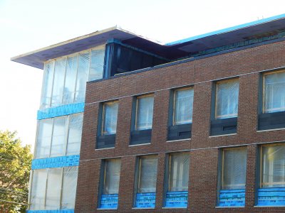 Complete with natty charcoal-gray Taktl inserts, a third-story row of dorm-room window units had been installed at 65 Campus Ave. by Oct. 16, 2015. (Doug Hubley/Bates College)