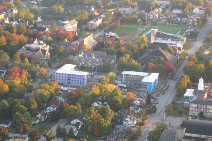 Taken by Judith Marden '66 from an ultralight aircraft piloted by Mike Theriault on Oct. 12, 2015, this campus view shows the L-shaped Campus Life Project dorms at center. (Judith Marden '66 for Bates College)