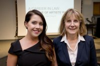 Christina Saunders '06 and Becky Corrie, Phillips Professor of Art and Visual Culture, pose in Olin 104 before Saunders' Nov. 4 talk. (Phyllis Graber Jensen/Bates College)