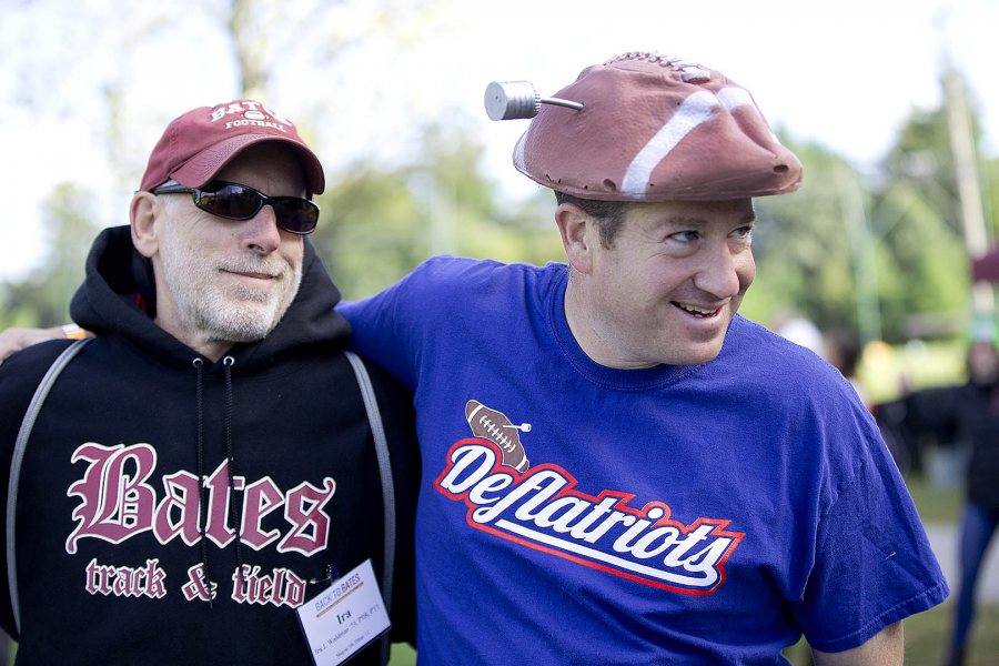 Michael Lieber '92 shows off his Deflatiots gear at Back to Bates on Oct. 3 as he hangs out with Ira Waldman '73. (Phyllis Graber Jensen/Bates College).