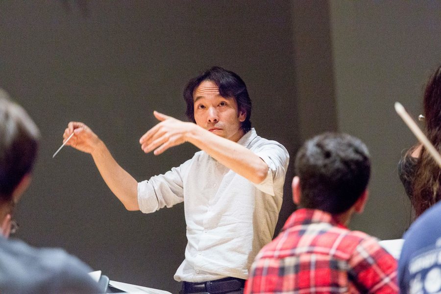 Hiroya Miura conducts the Bates College Orchestra in rehearsal in 2015. (Josh Kuckens/Bates College)