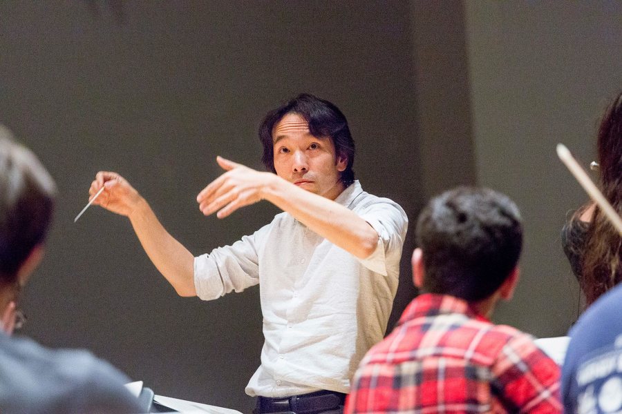 Hiroya Miura conducts the Bates College Orchestra in rehearsal on Nov. 3. (Josh Kuckens/Bates College)