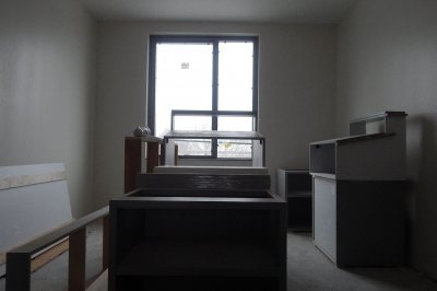 A double room on the fourth floor of 65 Campus Ave. serves as temporary storage for kitchen cabinetry on Jan. 12, 2016. (Doug Hubley/Bates College) 