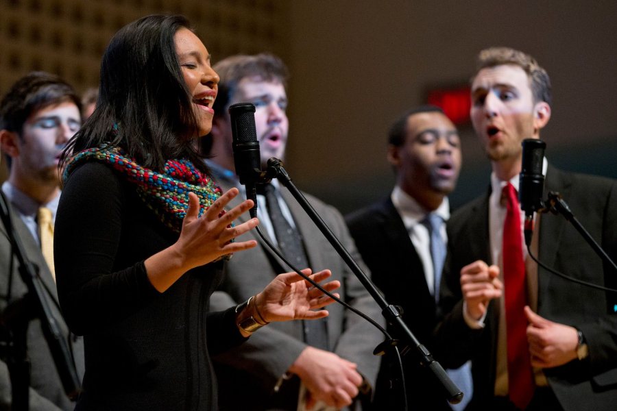 Supported by the Manic Optimists, Isabel Koyama sings “Till There Was You” during a memorial service for James Jhun '16 on Jan. 22, 2016. Jhun, Koyama and Jonah Greenawalt created the arrangement for the Meredith Willson tune. (Phyllis Graber Jensen/Bates College)