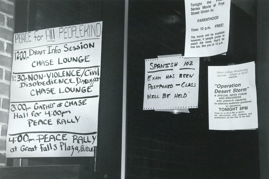 Flyers and messages during the Persian Gulf War hang, likely outside Ladd library, including one about the movie "Parenthood" being shown at Frye Street Union, noting that "if people prefer to watch the news, that'll be fine too." (Bates Communications)