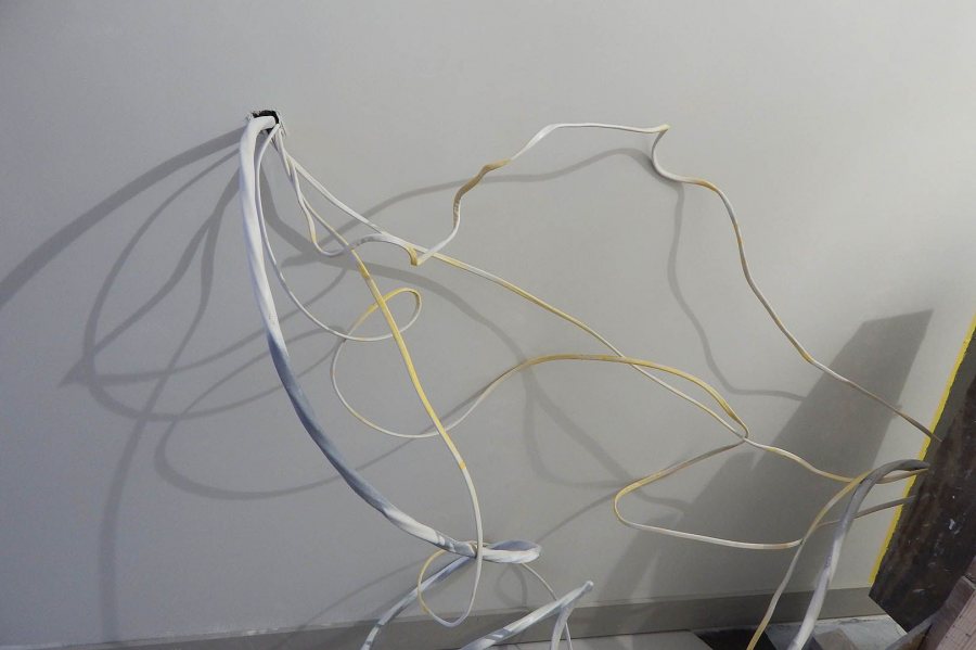 Assorted cables sprout from a wall at 65 Campus Ave. (Doug Hubley/Bates College)