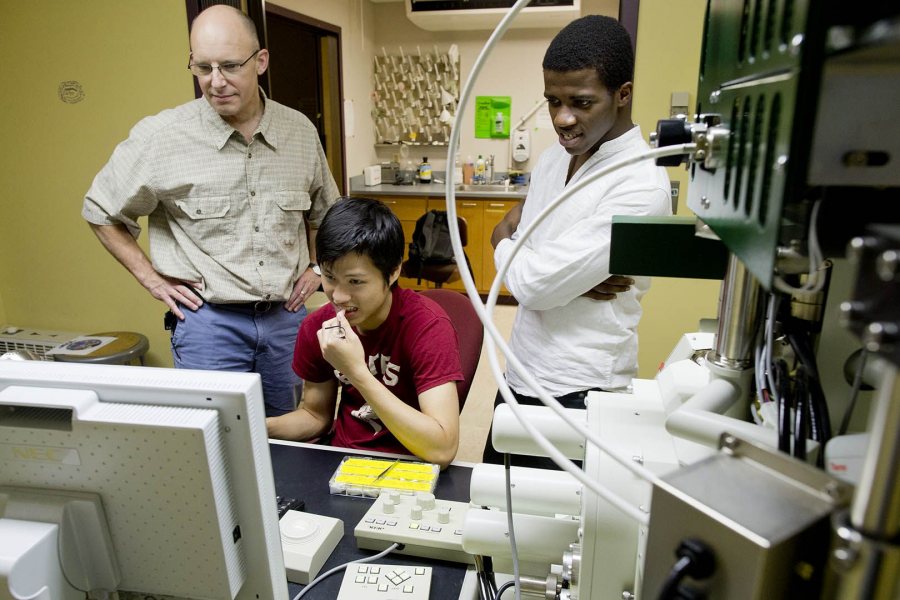 Bates summer student researchers Jia Ahn-Pan '16 of Kuching, Malaysia (seated) and Akachukwu Obi '15 (right) of Nnewi, Nigeria, work under the guidance of Associate Professor of Chemistry Matt Cote in August 2015. A new grant from the Sherman Fairchild Foundation will support 15 new student researchers at Bates. (Phyllis Graber Jensen/Bates College)