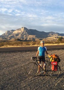 Katherine Creswell, who is on a California-to-Maine bicycle ride, pauses at Guadalupe Mountains National Park in Texas.