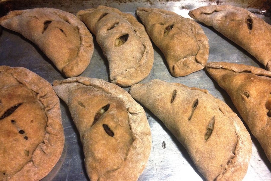Creswell's Maine version of empanadas are filled with skillet hash of potatoes, garlic, onion, kale, and ground beef.