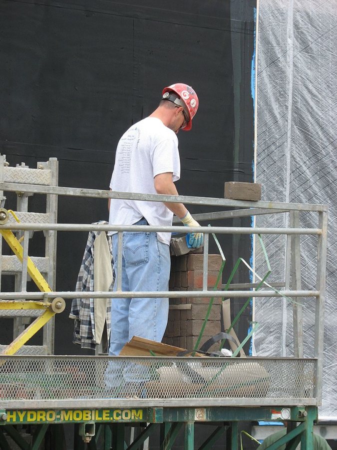 Work begins on the Commons' brick veneer on May 24, 2007. (Doug Hubley/Bates College)