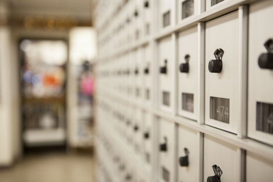 The postman doesn't not right for the mailboxes in Chase Hall. (Sarah Crosby/Bates College) 