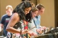 Zofia Ahmad '19 of Palo Alto, Calif. joins classmates for an encore at the Bates Steel Pan Orchestra concert.

The Bates Steel Pan Orchestra, under the direction of Duncan Hardy, performs traditional West Indies arrangements in the Olin Concert Hall on Monday, Dec. 7th 2015.